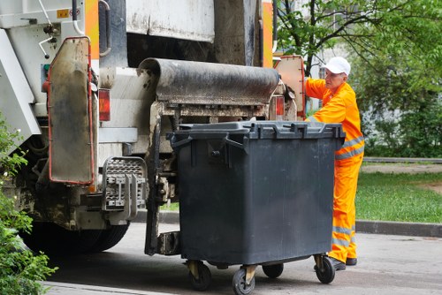 Inspector reviewing waste collection logs and vehicle tracking